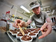 Army Reserve Soldier uses civilian skills to bring smiles to mobilized Soldiers