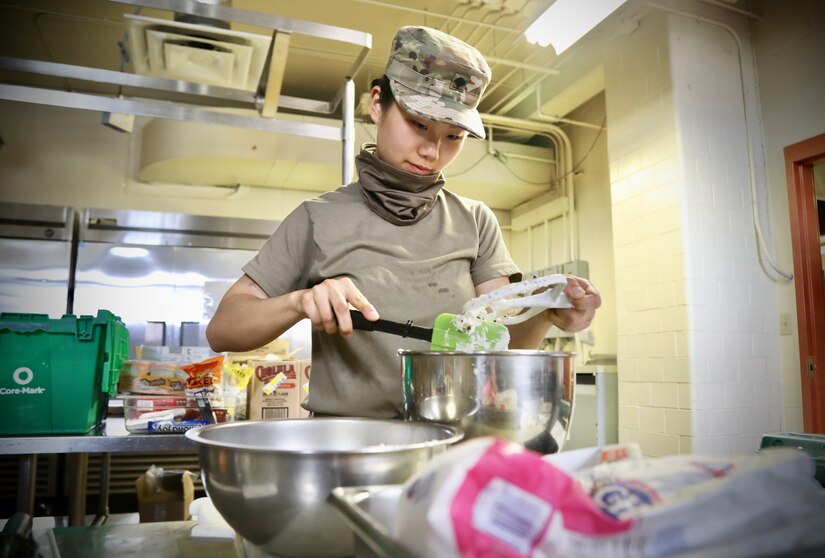 Army Reserve Soldier uses civilian skills to bring smiles to mobilized Soldiers