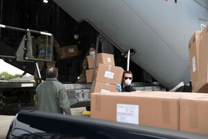 Turkish and U.S. crew members work together to unload a Turkish Airbus A400M Atlas at Joint Base Andrews, Md., Apr. 28, 2020. The aircraft landed at JBA with medical supplies to respond to the coronavirus pandemic, with Airmen assigned to the 89th Airlift Wing helping unload the materials. (U.S. Air Force photo by Airman 1st Class Spencer Slocum)