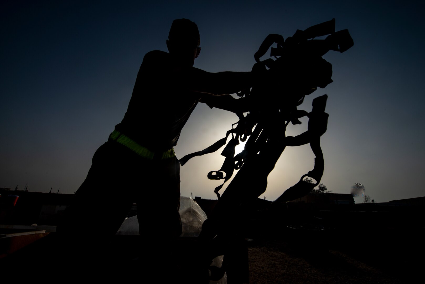 Photo of Airmen working on cargo nets