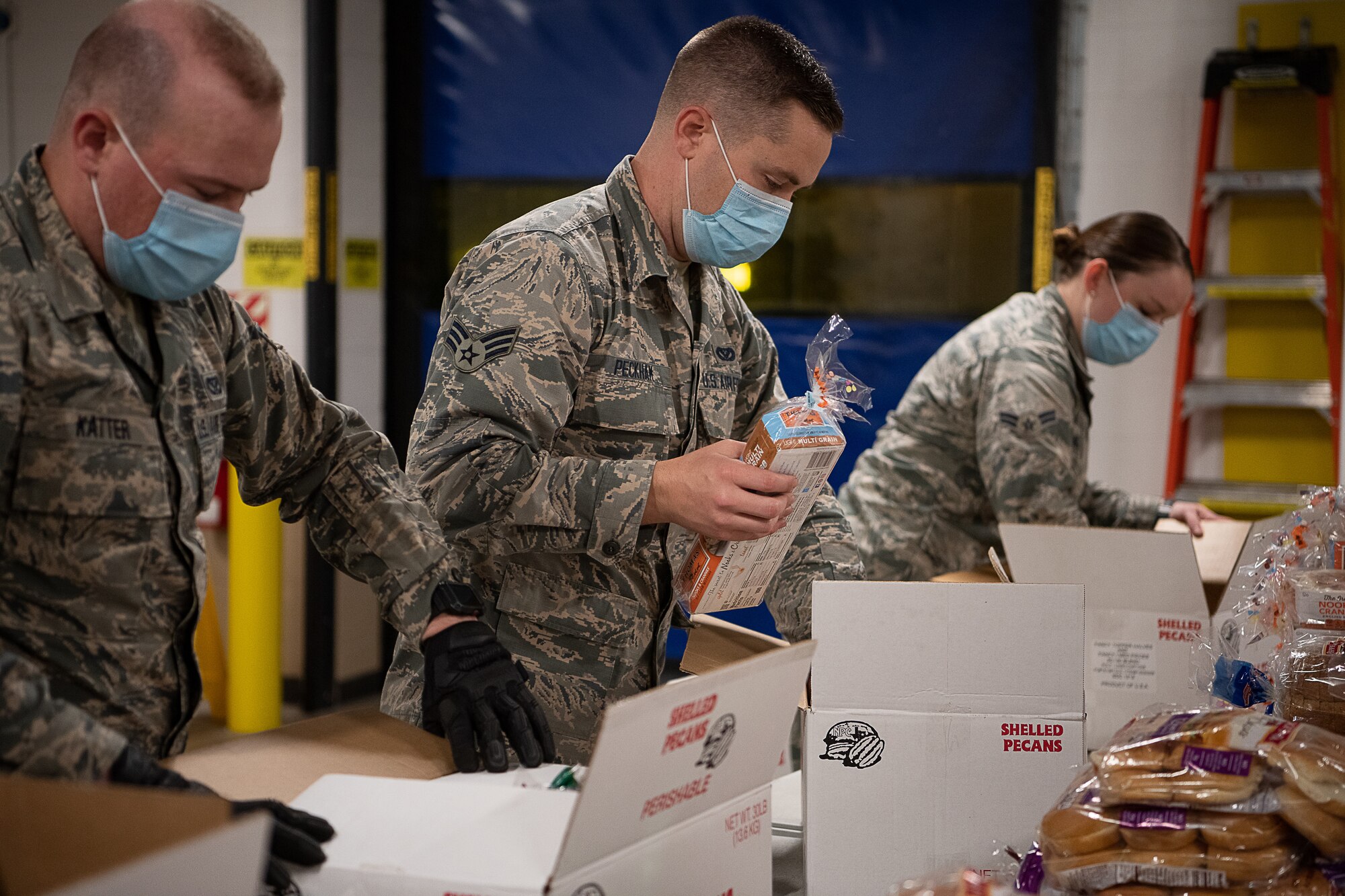 Members of the Oklahoma Air National Guard with the 137th Special Operations Wing pack and sort boxes of food for transport in support of the Regional Food Bank of Oklahoma in Oklahoma City, April 24, 2020. Gov. Kevin Stitt activated 25 additional Guardsmen in Oklahoma City and another 25 in Tulsa to assist the regional food banks.