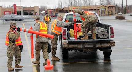 Alaska National Guard Soldiers and Airmen, Alaska State Defense Force Soldiers and Naval Militiamen assigned to a joint task force supported the Food Bank of Alaska by establishing an efficient food distribution area in Muldoon April 20, 2020.
