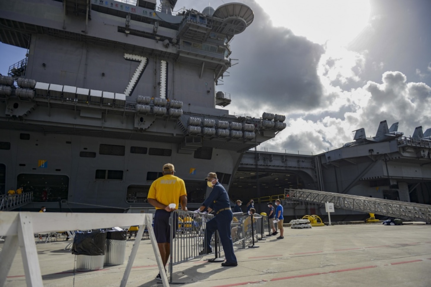 USS Theodore Roosevelt's (CVN 71) essential watch standers and cleaning team conducted a crew swap April 29, turning over a clean ship to a COVID negative crew after completion of their off-ship quarantine or isolation. Thousands of Sailors from Theodore Roosevelt were moved to local hotels in an effort to implement an aggressive mitigation strategy to minimize the spread of COVID-19 and protect the health of the Sailors.