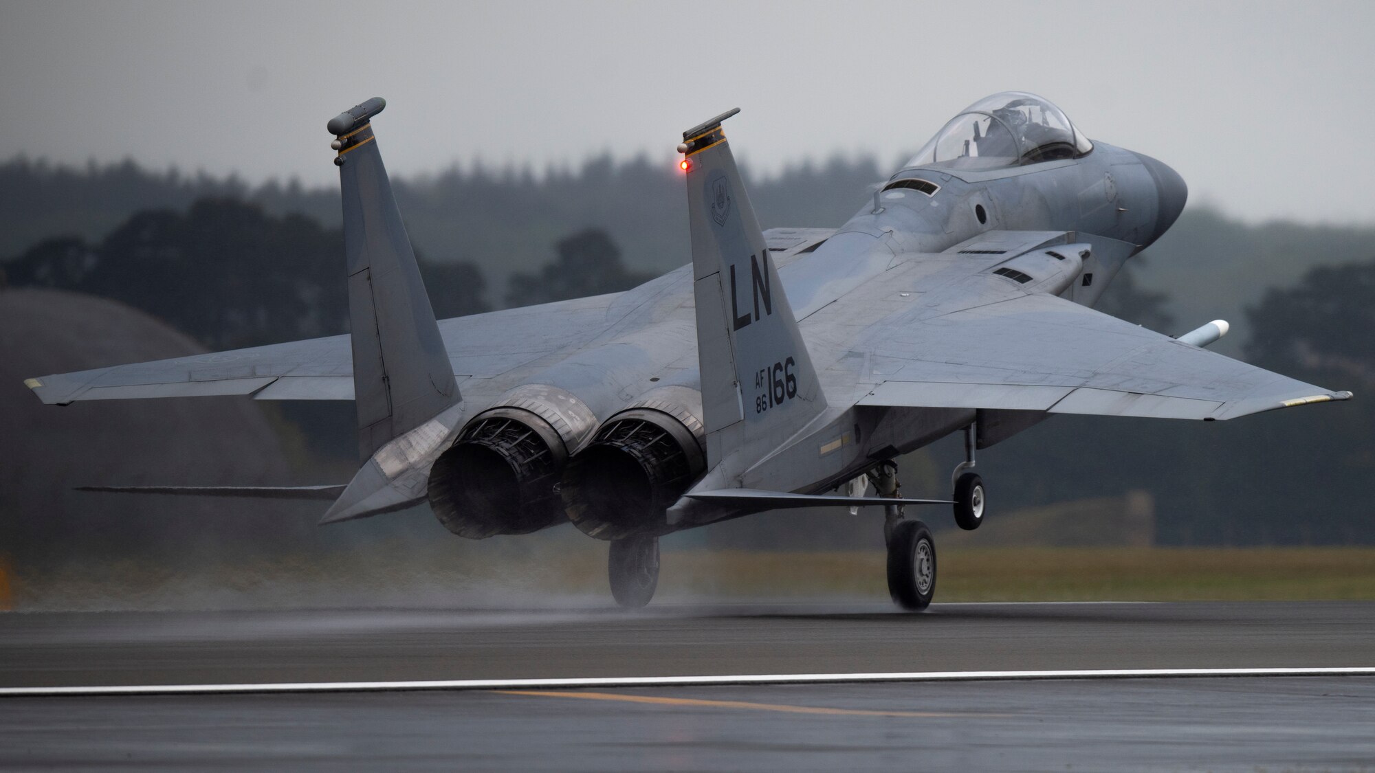 An F-15C Eagle assigned to the 493rd Fighter Squadron lands at Royal Air Force Lakenheath, England, April 28, 2020. Despite the current COVID-19 crisis, the 48th Fighter Wing is committed to staying ready to deliver combat air power when called upon by U.S. Air Forces in Europe-Air Forces Africa. (U.S. Air Force photo by Airman 1st Class Jessi Monte)