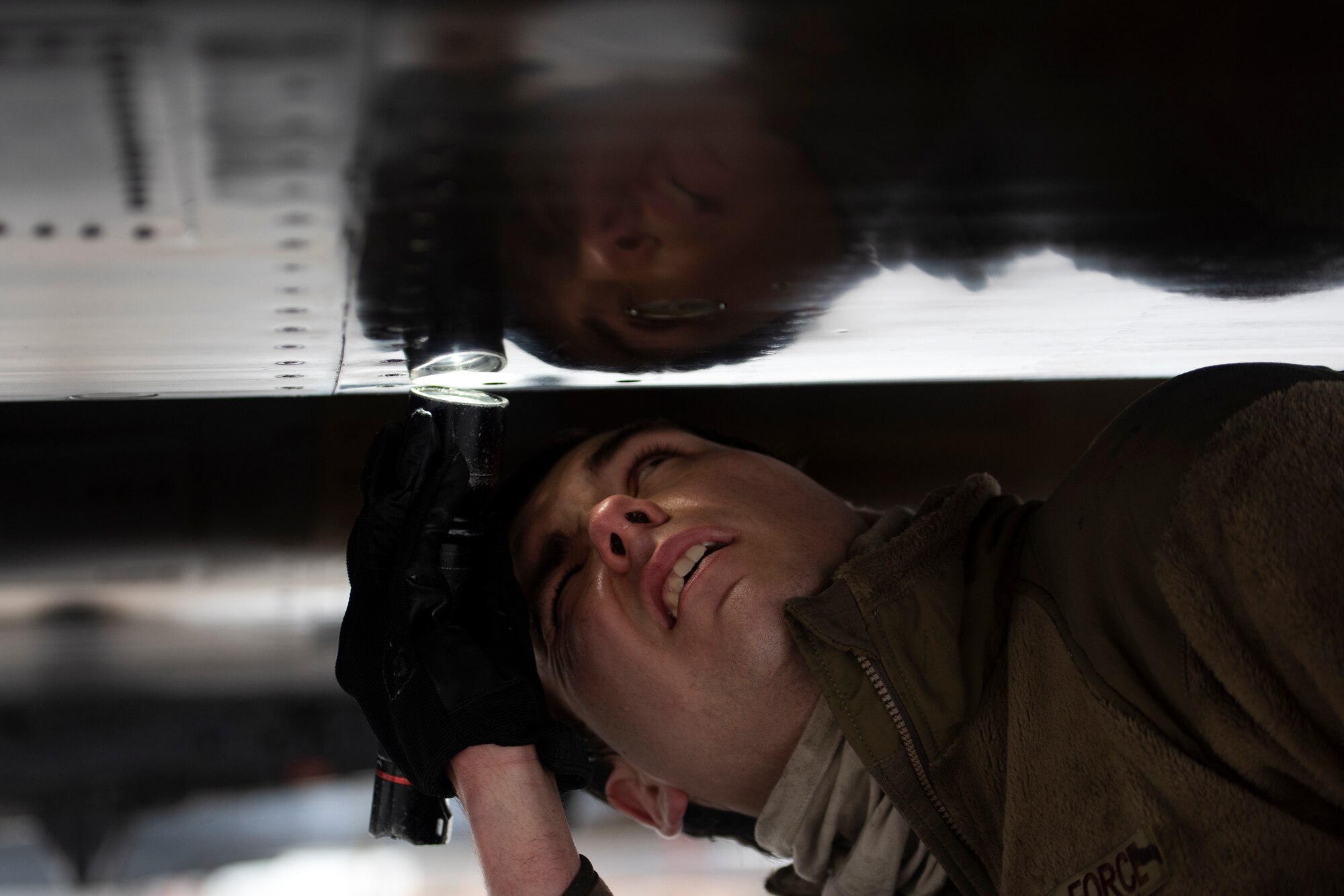 A 494th Fighter Squadron Aircraft Maintenance Unit crew chief conducts post-flight inspections following a training flight at Royal Air Force Lakenheath, England, April 28, 2020. The 48th Fighter Wing continues to maintain mission-readiness in order to safeguard U.S. national interests and those of our allies and partners, despite the current COVID-19 crisis. (U.S. Air Force photo by Airman 1st Class Jessi Monte)