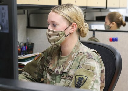 Army National Guard Pfc. Tori Stricklin, a human resource specialist with the 176th Engineer Brigade, updates the Joint Task Force 176 personnel status roster at Camp Mabry in Austin, Texas, April 17, 2020. Stricklin is one of several service members who normally serve on a part-time basis, but were activated to full-time duty after the COVID-19 pandemic impacted their full-time employment.