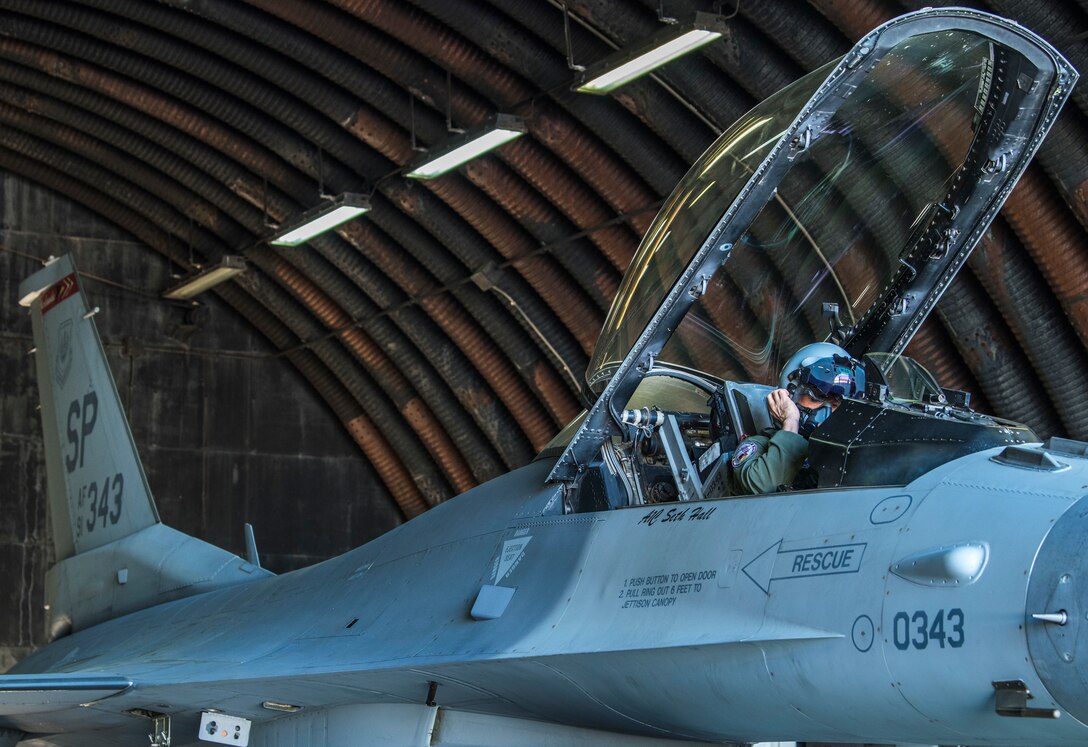 Close up of military pilot in cockpit.
