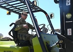 Spc. Andre St. Laurent, Headquarters and Service Company, 3643d Brigade Support Battalion, New Hampshire Army National Guard, loads freight from a warehouse in Concord.