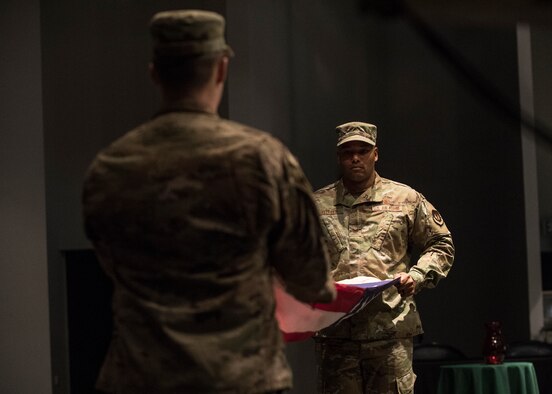 U.S. Air Force Tech. Sgt. Graeme Clouden, 786th Civil Engineer Squadron expeditionary engineering training manager, and Staff Sgt. Joseph Fabiano,435th Construction and Training Squadron engineering contingency instructor, perform a flag folding ceremony for Retired Maj. Ralph L. Turner, Tuskegee Airman, at Ramstein Air Base, Germany, April 24, 2020.