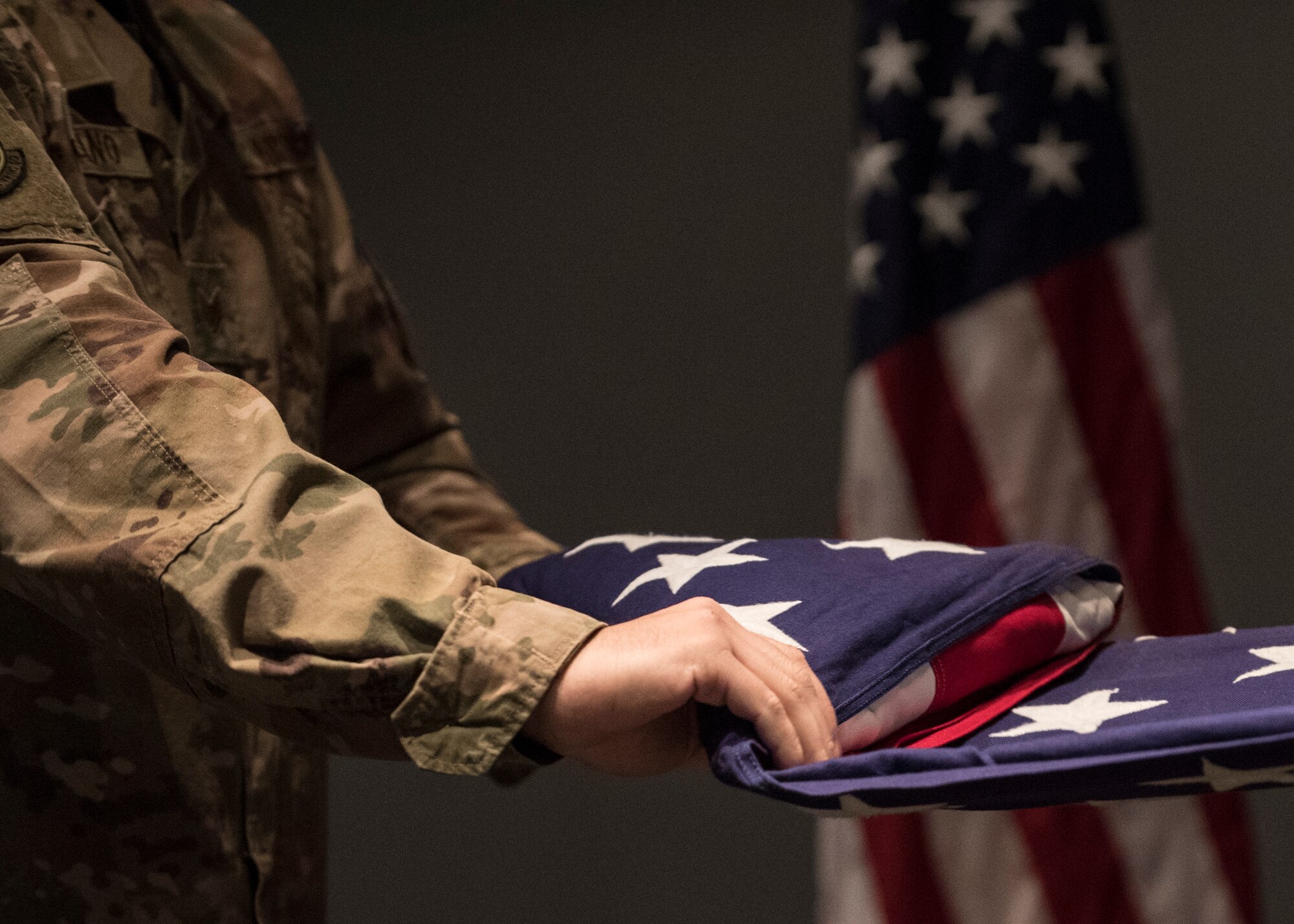 U.S. Air Force Staff Sgt. Joseph Fabiano, 435th Construction and Training Squadron engineering contingency instructor, performs a flag folding ceremony for Retired Maj. Ralph L. Turner, Tuskegee Airman, at Ramstein Air Base, Germany, April 24, 2020.
