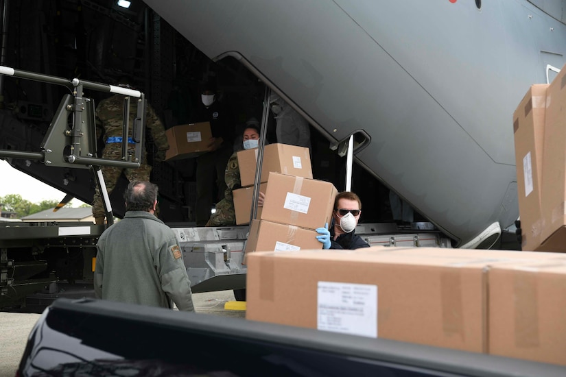 Turkish and U.S. Air Force crew members unload medical supplies from a Turkish Airbus A400M Atlas.