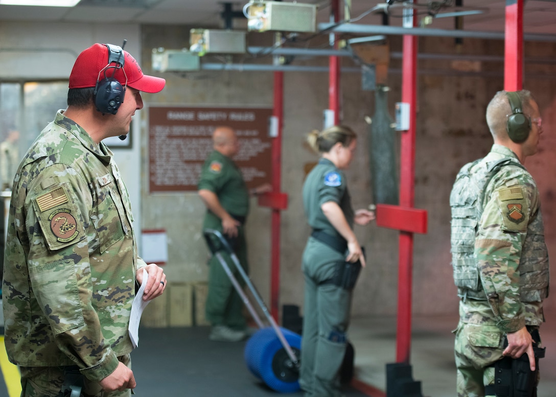 Staff Sgt. Brent Pico, 56th Security Forces Squadron Combat Arms Training and Maintenance flight instructor, instructs a Combat Arms Training and Maintenance M9 pistol course April 15, 2020, at Luke Air Force Base, Ariz.