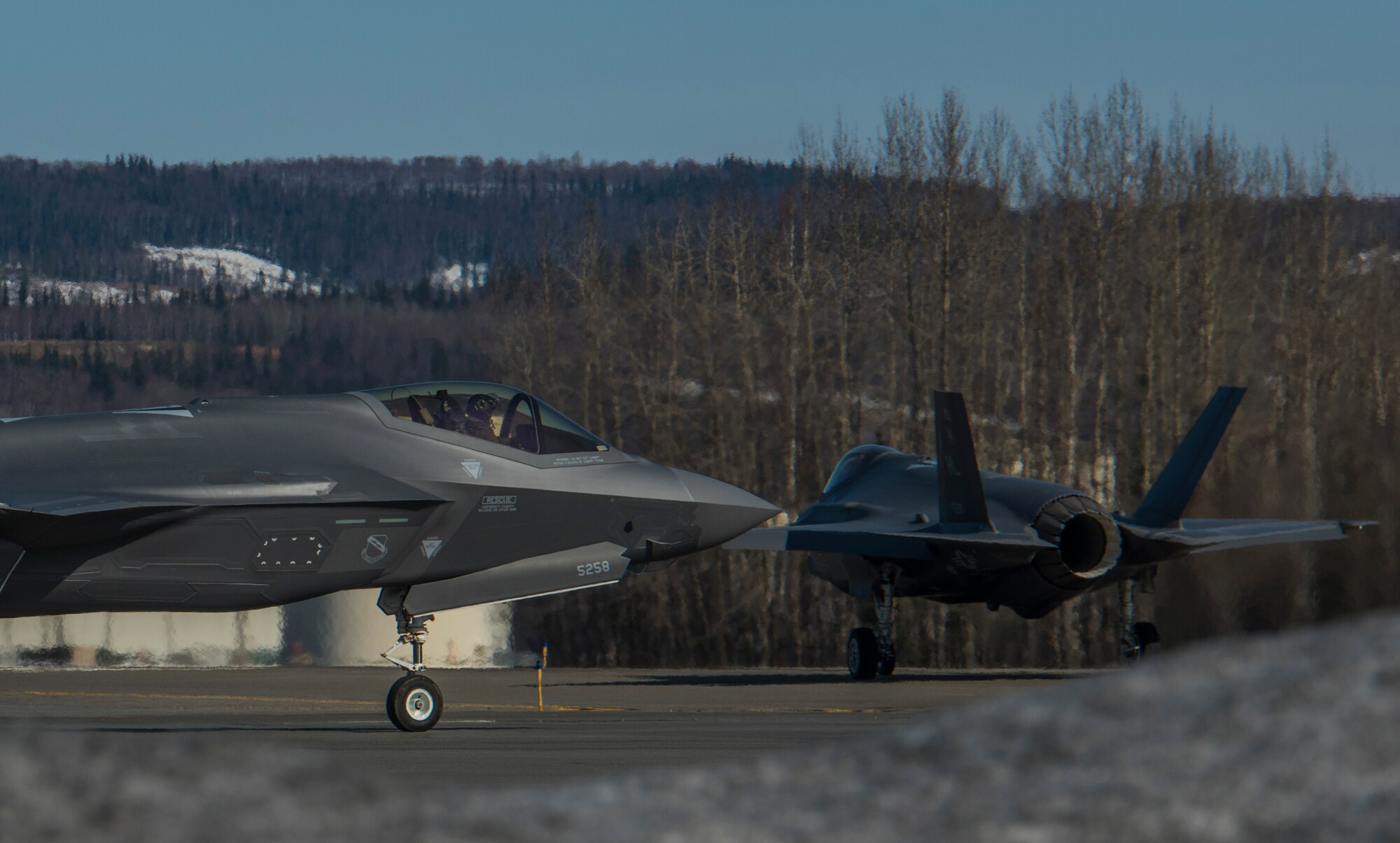 Two U.S. Air Force F-35A Lightning II fifth-generation aircraft assigned to the 388th Fighter Wing taxi on the Eielson Air Force Base, Alaska, flight line April 27, 2020.