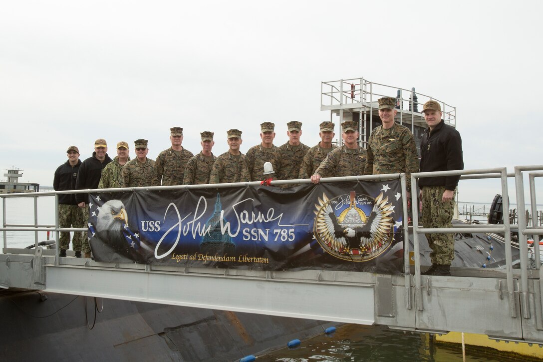 Senior Marine Corps and Navy leaders pose onboard the USS John Warner (SSN-785) at Naval Station Norfolk, Norfolk, Virginia, Jan. 31, 2020. Leaders toured the vessel to become familiar with the ship’s capabilities, increasing naval integration. The USS John Warner is a Virginia-class fast-attack submarine launched on Sept. 10, 2014. (U.S. Marine Corps Photo by Sgt. Danielle Prentice/released)