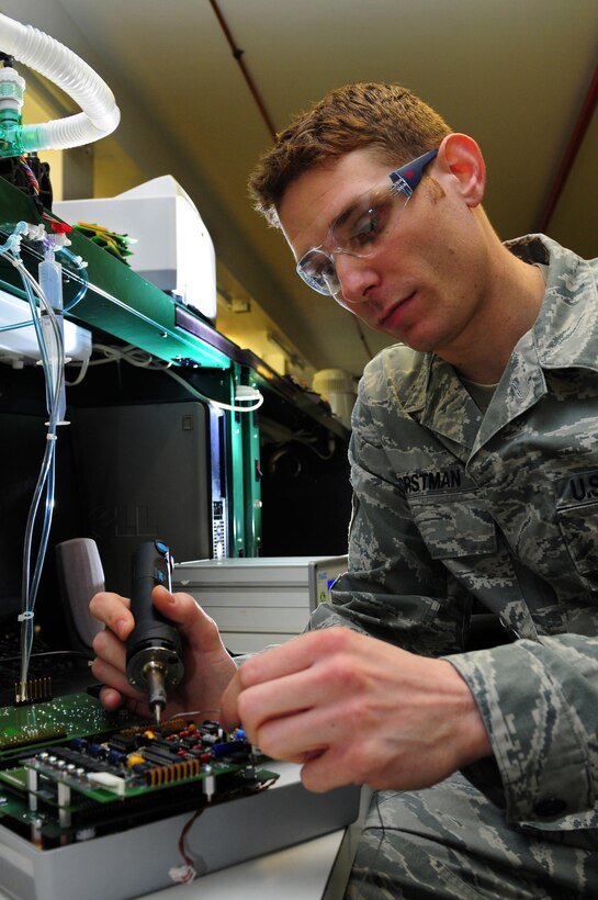 U.S. Air Force Senior Airman Travis Horstman, 86th Medical Support Squadron, repairs a Pulmonetic Systems LTV 1000 Series Ventilator, Ramstein Air Base, Germany, March 28, 2011. The ventilator provides continuous or intermittent breathing support for patients who require assisted ventilation. (U.S. Air Force photo/Airman 1st Class Brea Miller)