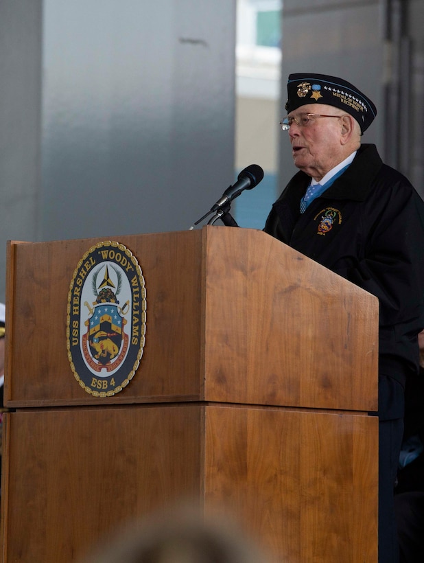 World War II Medal of Honor recipient Hershel Woodrow “Woody” Williams, a retired U.S. Marine, speaks during the ship commissioning ceremony for the USNS Hershel “Woody” Williams at the Half Moone Cruise and Celebration Center in Norfolk, Virginia, on Mar. 7, 2020. The USNS Hershel “Woody” Williams will serve as a flexible platform to support a variety of missions, including air mine countermeasures, counter-piracy operations, maritime security and humanitarian missions. The Ship is named in honor of Williams for his gallant efforts during the battle of Iwo Jima. (U.S. Marine Corps Photo by Cpl. Desmond Martin)