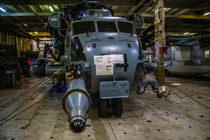 U.S. Marines with Marine Heavy Helicopter Squadron 463, Marine Aircraft Group 24, stage their aircraft aboard a vehicle carrier vessel on Joint Base Pearl Harbor-Hickam, April 24, 2020. HMH-463 offloaded a CH-53E following a maintenance operation overseas. (U.S. Marine Corps photo by Lance Cpl. Jacob Wilson)