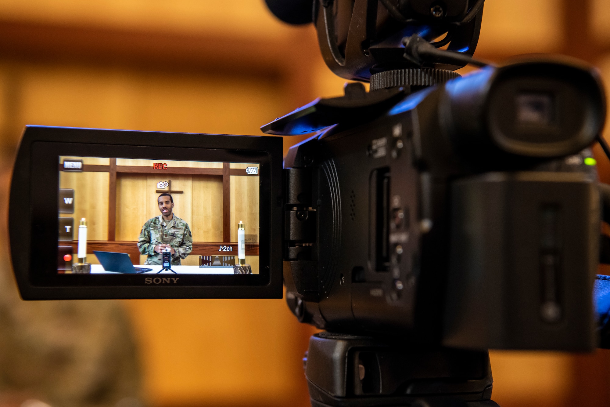 Chaplain (Capt.) Andre Davis, 436th Airlift Wing chaplain, speaks during a service recording April 25, 2020, at Chapel 1 on Dover Air Force Base, Delaware. The recordings are created during the week and aired on Sunday due to COVID-19 restrictions. The recordings allow the chapel to provide services while ensuring people's safety. (U.S. Air Force photo by Senior Airman Christopher Quail)