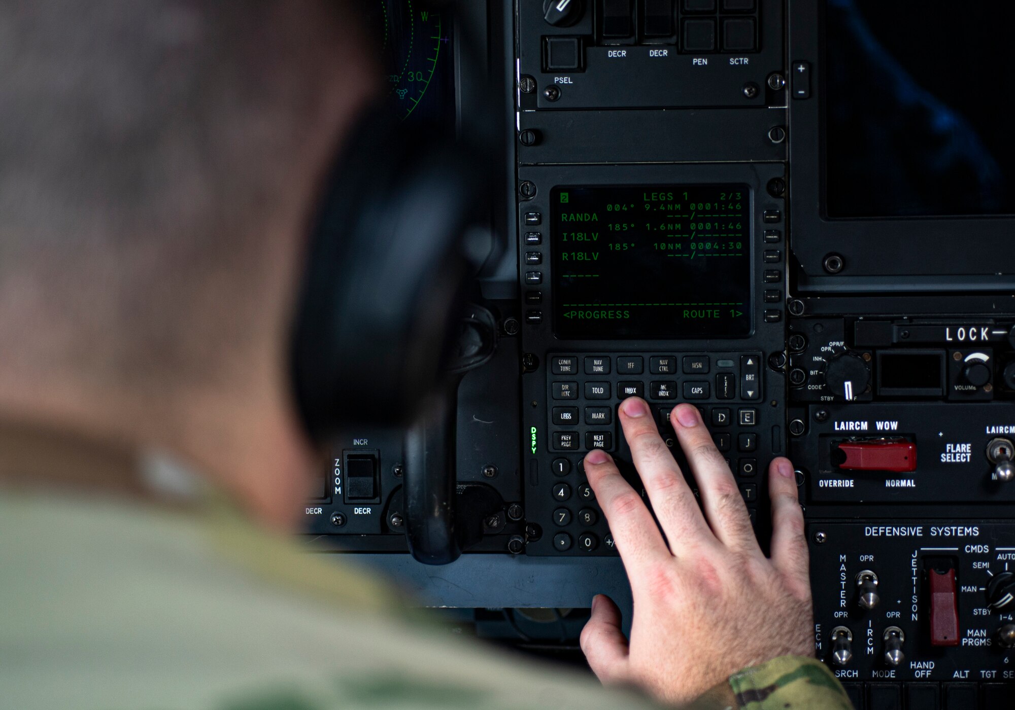 Photo of an Airman conducting a pre-flight check in an HC-130J Combat King II.