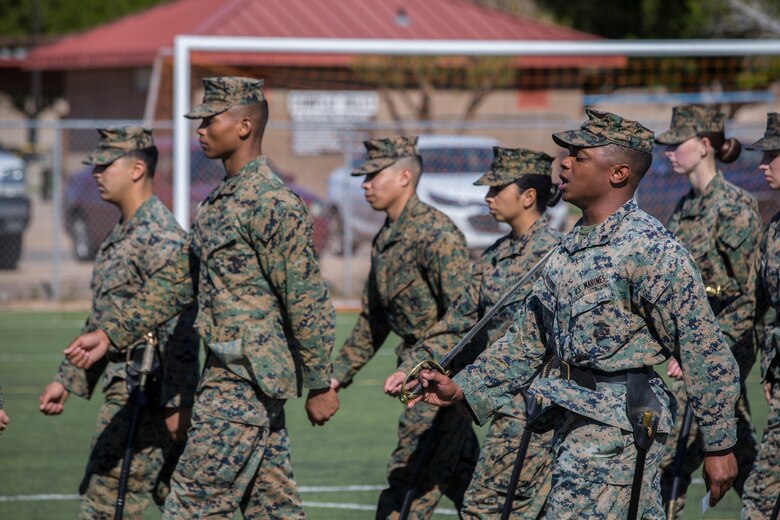 U.S. Marines stationed at Marine Corps Air Station (MCAS) Yuma conduct sword manual and drill as part of their final examination for the Corporals Course curriculum on the MCAS Yuma Ramada field, Jan 27, 2019. Corporals Course is a leadership class designed to teach Marines the fundamentals that go in to being an effective noncomissioned officer. (U.S. Marine Corps photo by Lance Cpl John Hall)