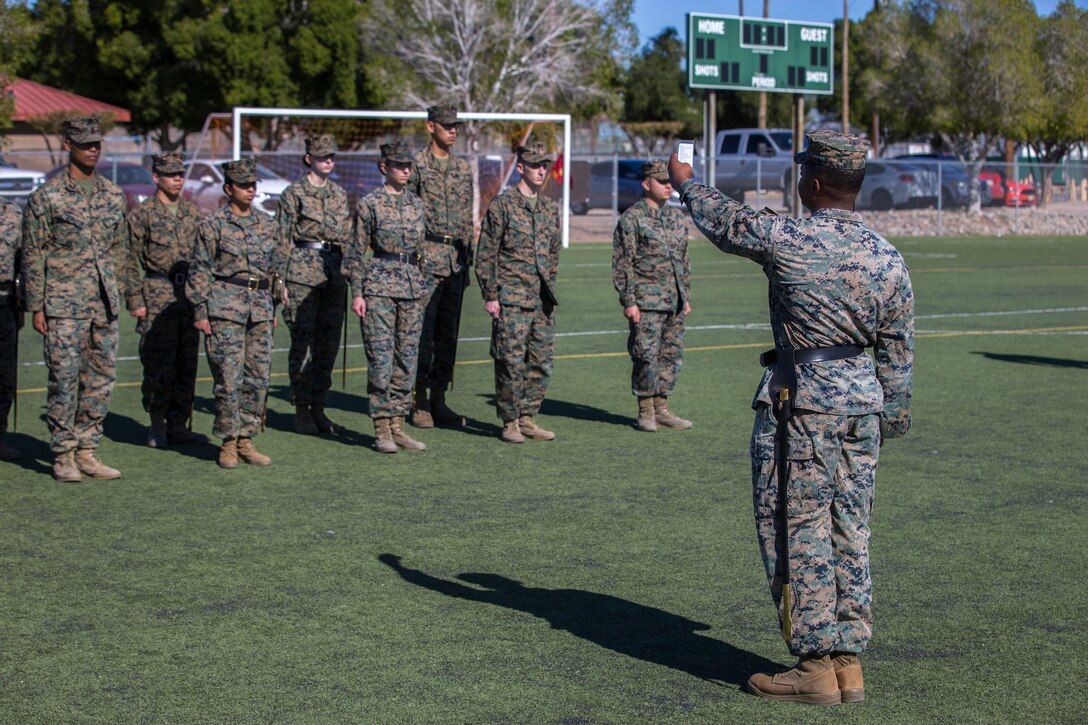 U.S. Marines stationed at Marine Corps Air Station (MCAS) Yuma conduct sword manual and drill as part of their final examination for the Corporals Course curriculum on the MCAS Yuma Ramada field, Jan 27, 2019. Corporals Course is a leadership class designed to teach Marines the fundamentals that go in to being an effective noncomissioned officer. (U.S. Marine Corps photo by Lance Cpl John Hall)