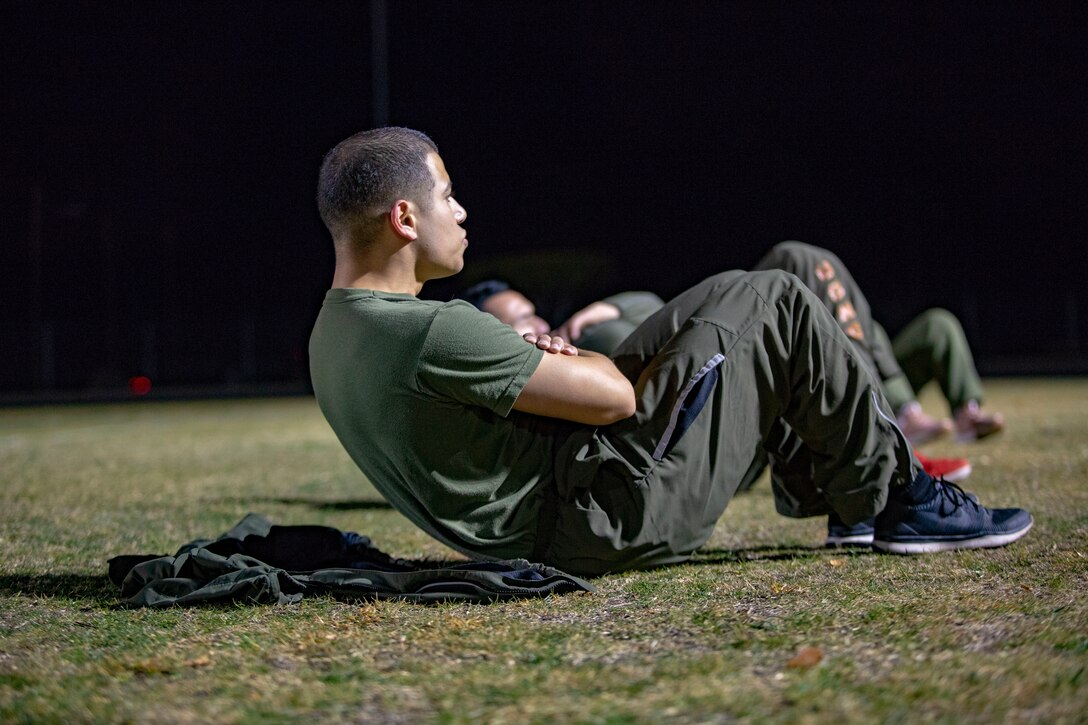 U.S. Marines and Sailors assigned to Headquarters and Headquarters Squadron (H&HS) participate in a squadron physical training (PT) session on Marine Corps Air Station (MCAS) Yuma, Ariz., Jan. 10, 2020. The PT session consisted of: burpees, crunches, flutter kicks, squats and running laps around the track. (U.S. Marine Corps photo by Lance Cpl. Gabrielle Sanders)