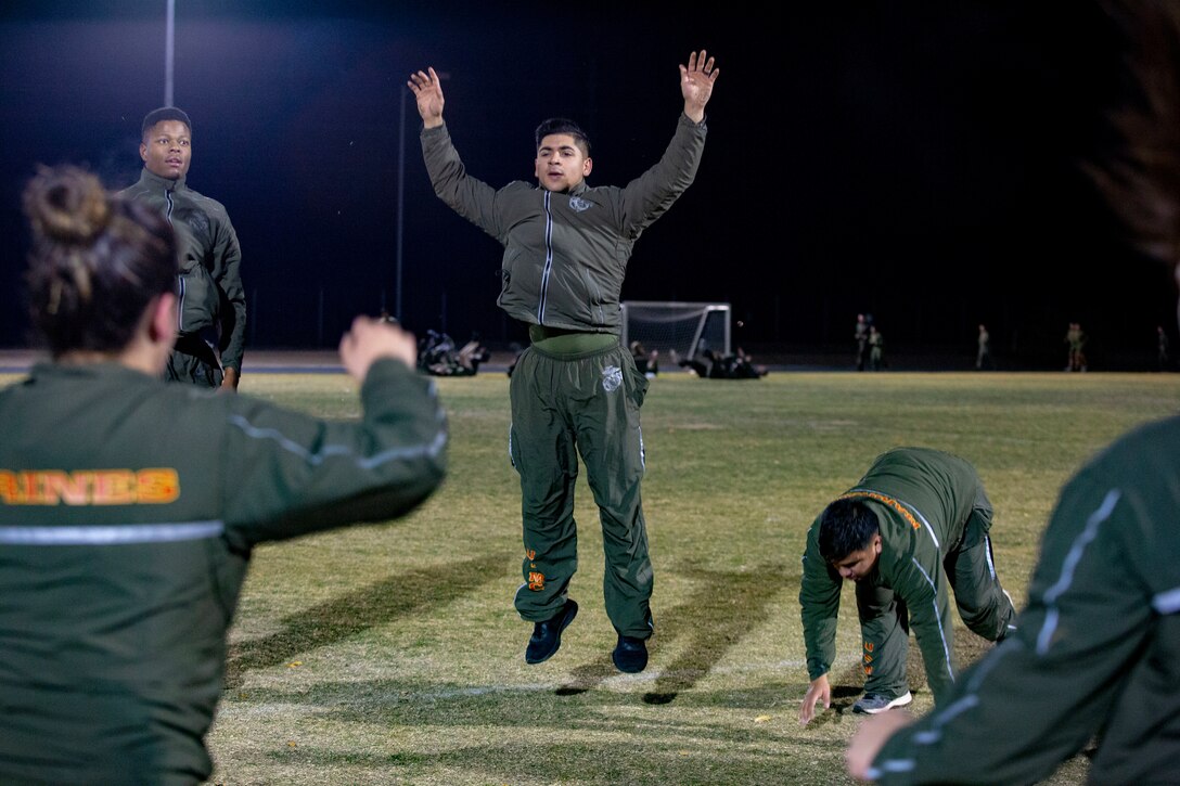 U.S. Marines and Sailors assigned to Headquarters and Headquarters Squadron (H&HS) participate in a squadron physical training (PT) session on Marine Corps Air Station (MCAS) Yuma, Ariz., Jan. 10, 2020.