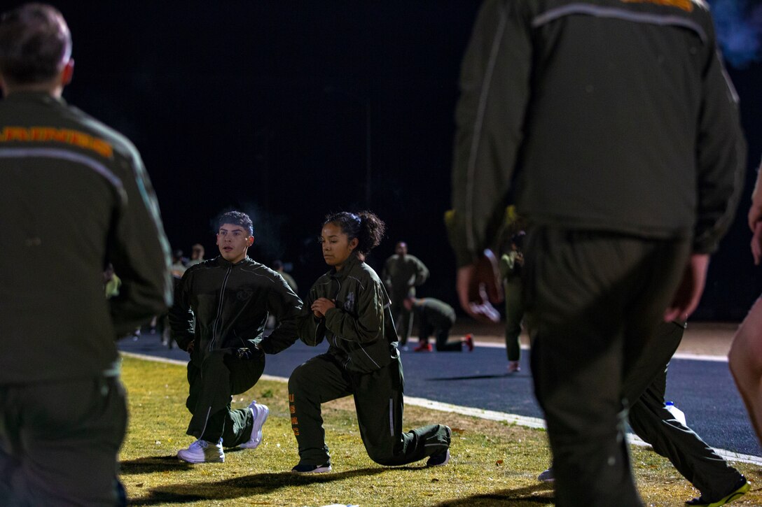 U.S. Marines and Sailors assigned to Headquarters and Headquarters Squadron (H&HS) participate in a squadron physical training (PT) session on Marine Corps Air Station (MCAS) Yuma, Ariz., Jan. 10, 2020.