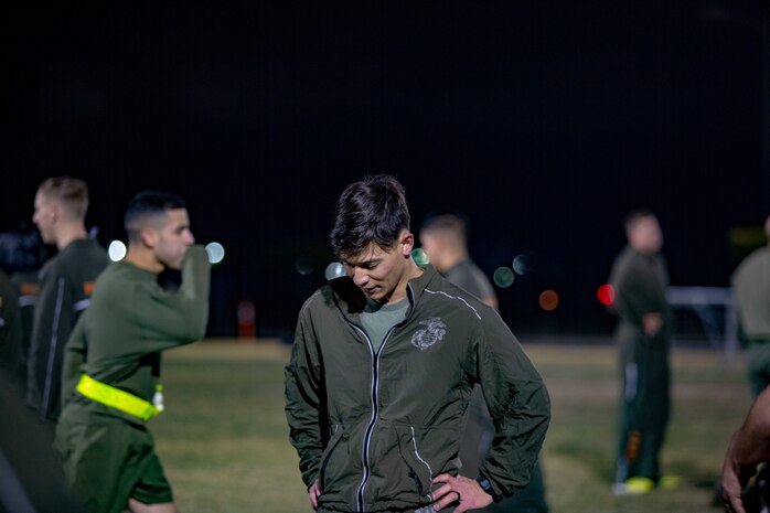 U.S. Marines and Sailors assigned to Headquarters and Headquarters Squadron (H&HS) participate in a squadron physical training (PT) session on Marine Corps Air Station (MCAS) Yuma, Ariz., Jan. 10, 2020. The PT session consisted of: burpees, crunches, flutter kicks, squats and running laps around the track. (U.S. Marine Corps photo by Lance Cpl. Gabrielle Sanders)