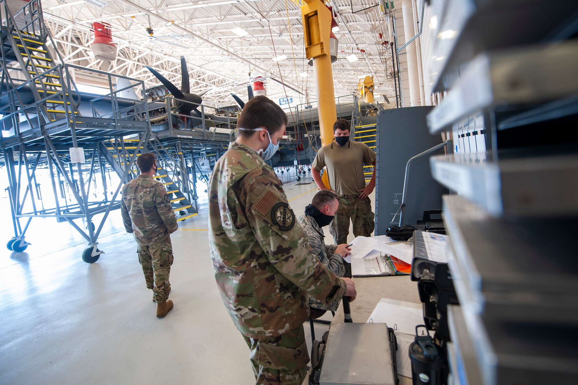 A picture of Airmen looking at paperwork