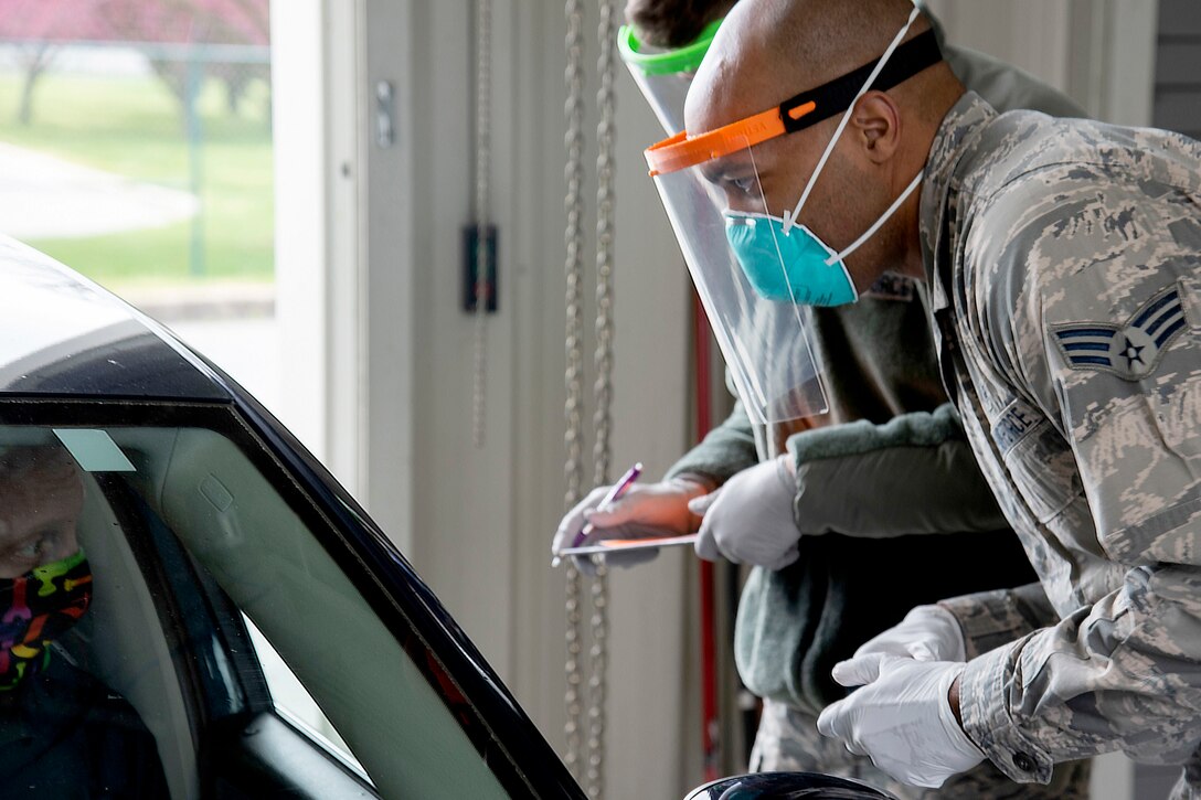 Airmen wear 3D-printed face shields.