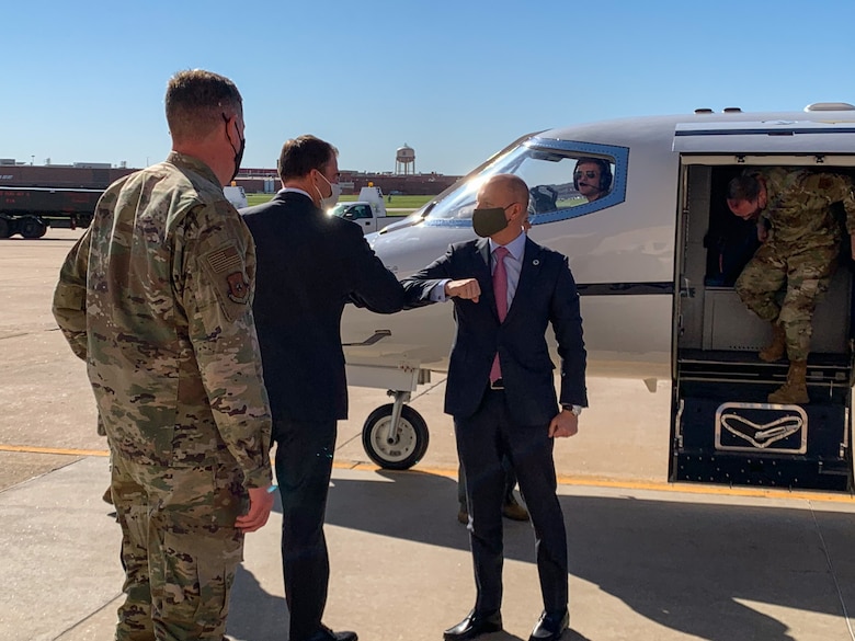 While performing the duties of Under Secretary of the Air Force Shon Manasco is greeted by Oklahoma Gov. Kevin Stitt after arriving at Tinker Air Force Base, Oklahoma, April 29, 2020.  Manasco visited Tinker in order to learn more about how the base has adapted to the COVID-19 crisis. (U.S. Air Force photo by Jonathan Stock)