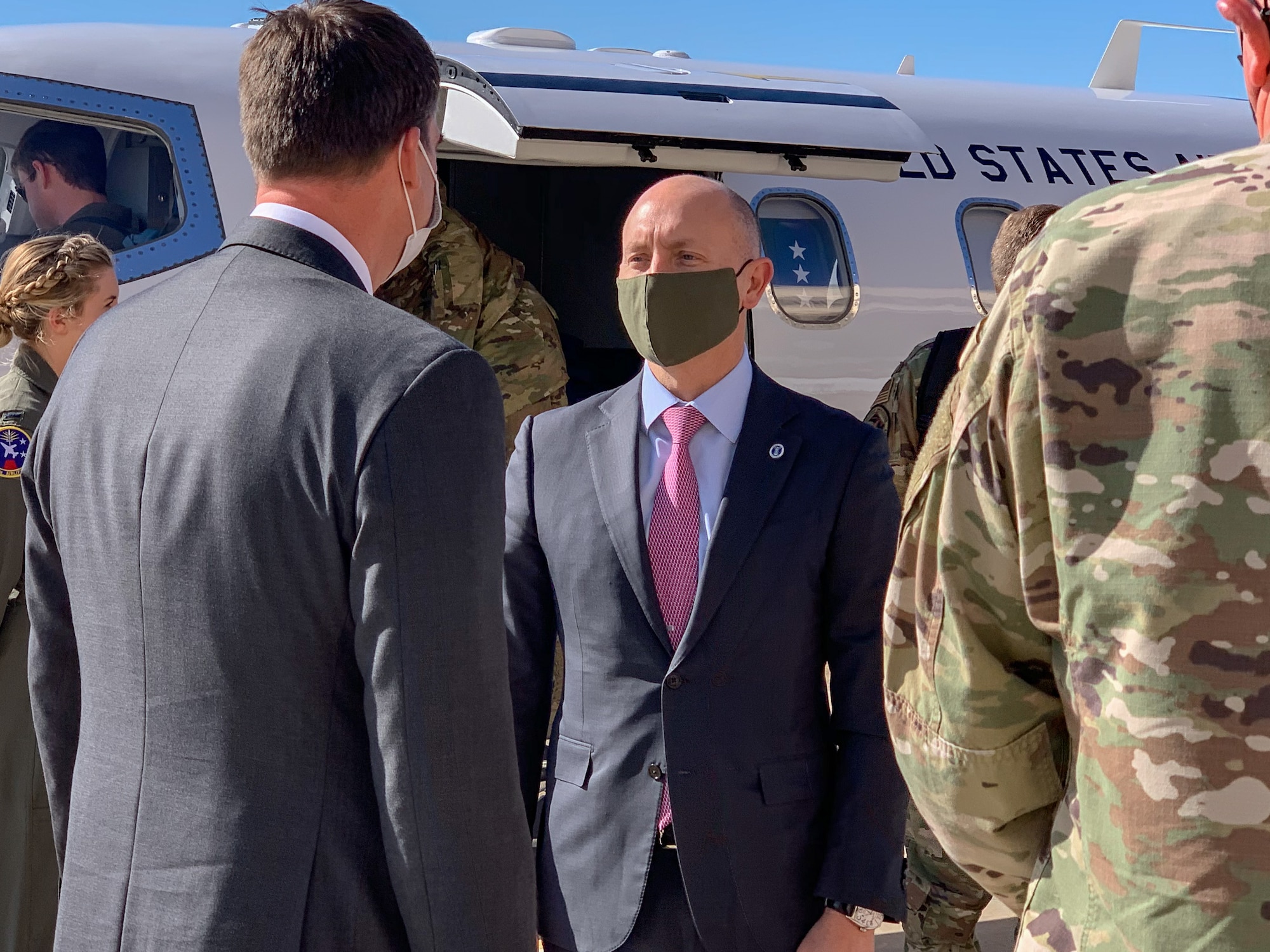 While performing the duties of Under Secretary of the Air Force Shon Manasco  is greeted by Oklahoma Gov. Kevin Stitt as he arrives at Tinker Air Force Base, Oklahoma, April 29, 2020.  Manasco visited Tinker in order to learn more about how the base has adapted to the COVID-19 crisis.