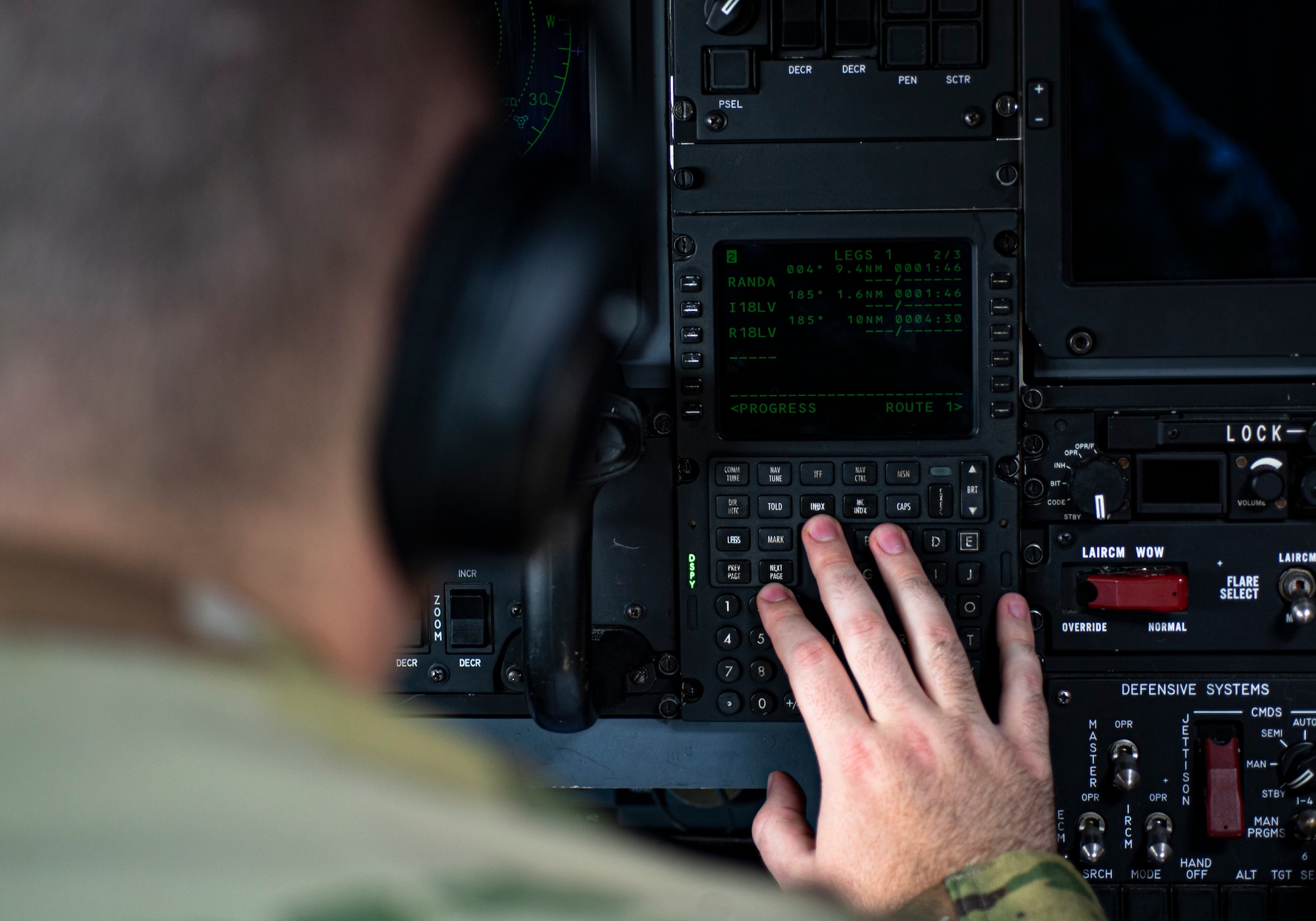 Photo of an Airman conducting a pre-flight check in an HC-130J Combat King II.