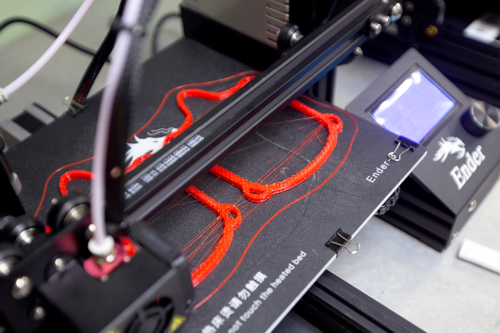 3D printer printing mask frames.