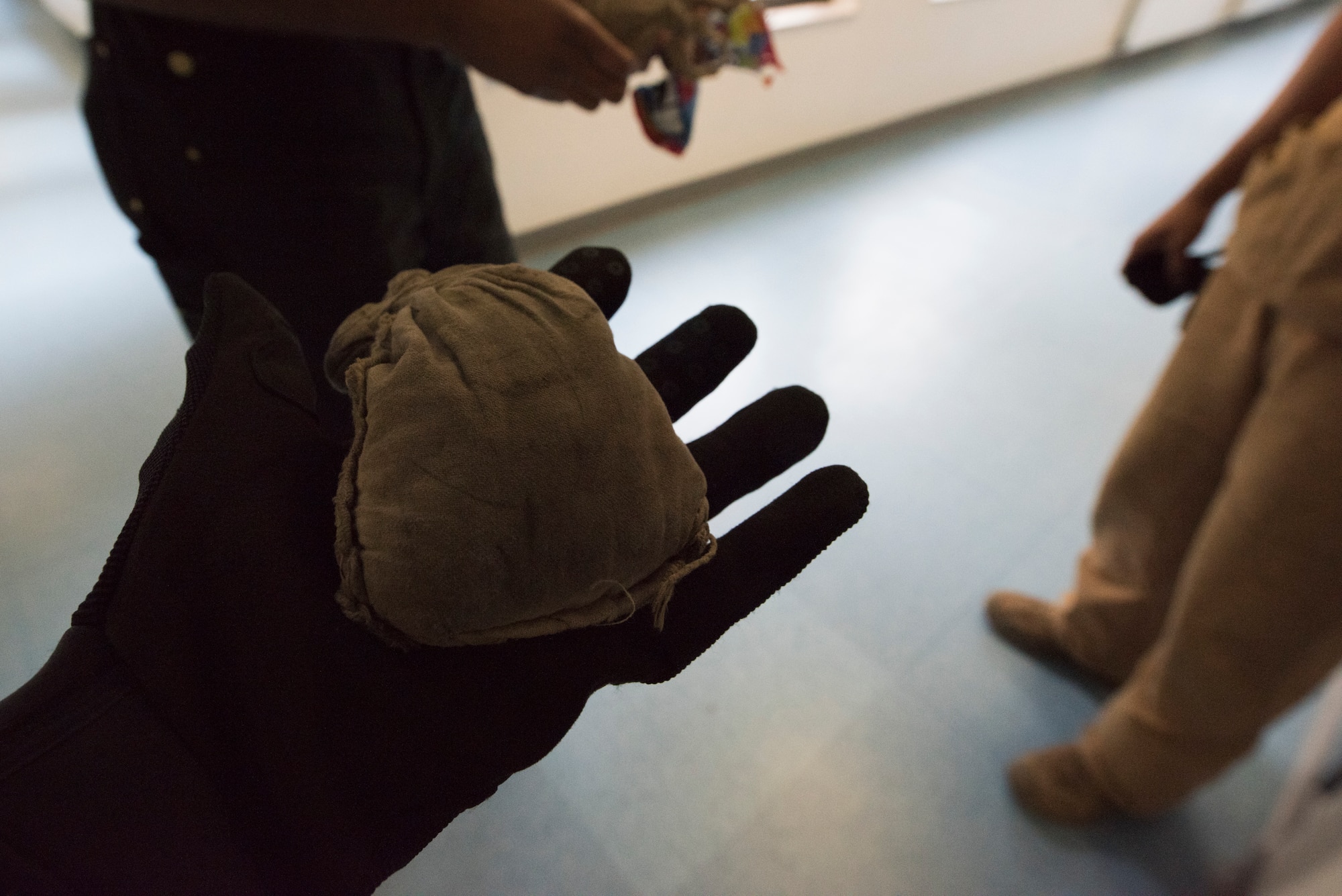 Photo of an Airman holding a beanbag