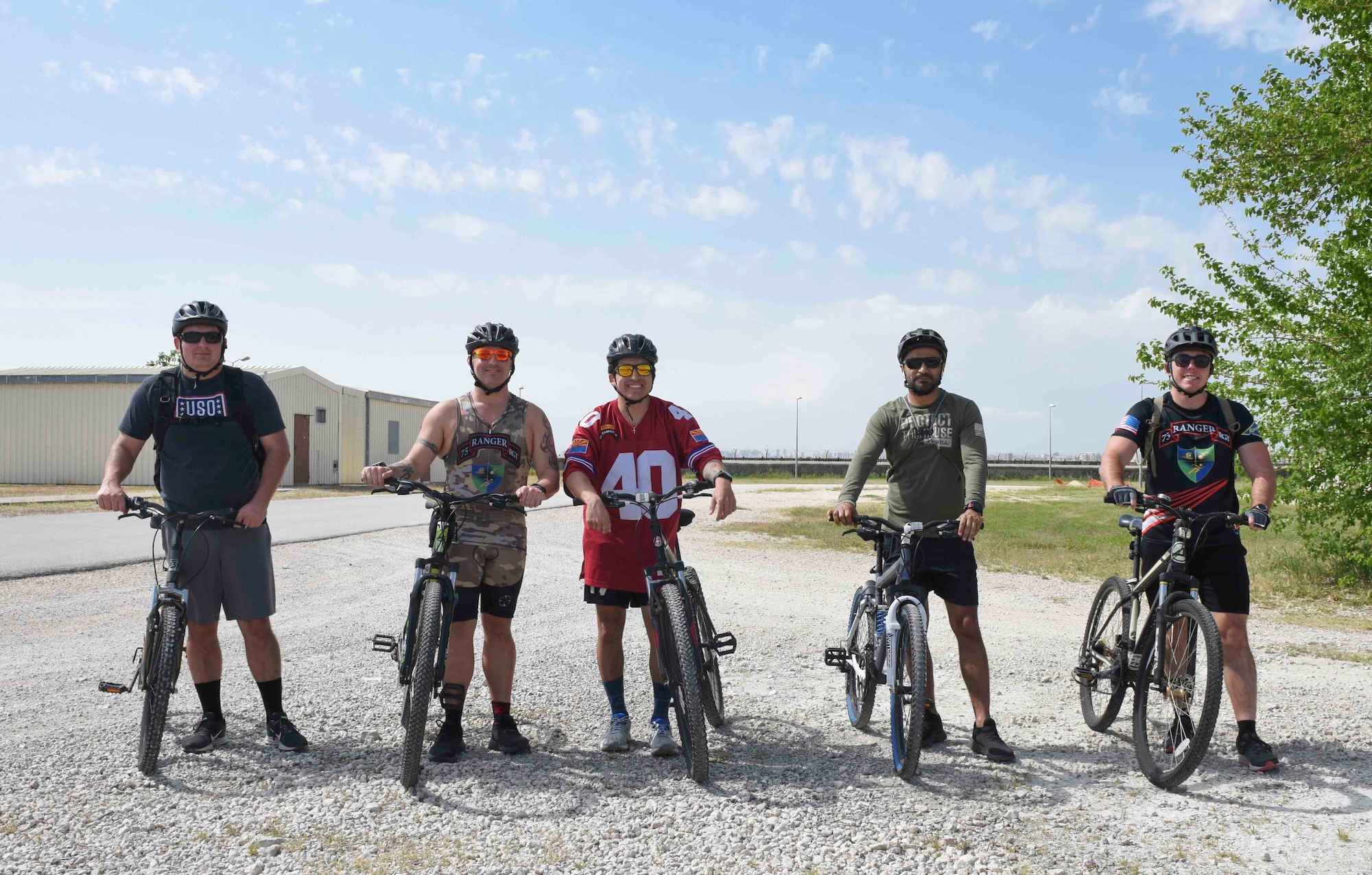 Group photo of Airmen with their bikes