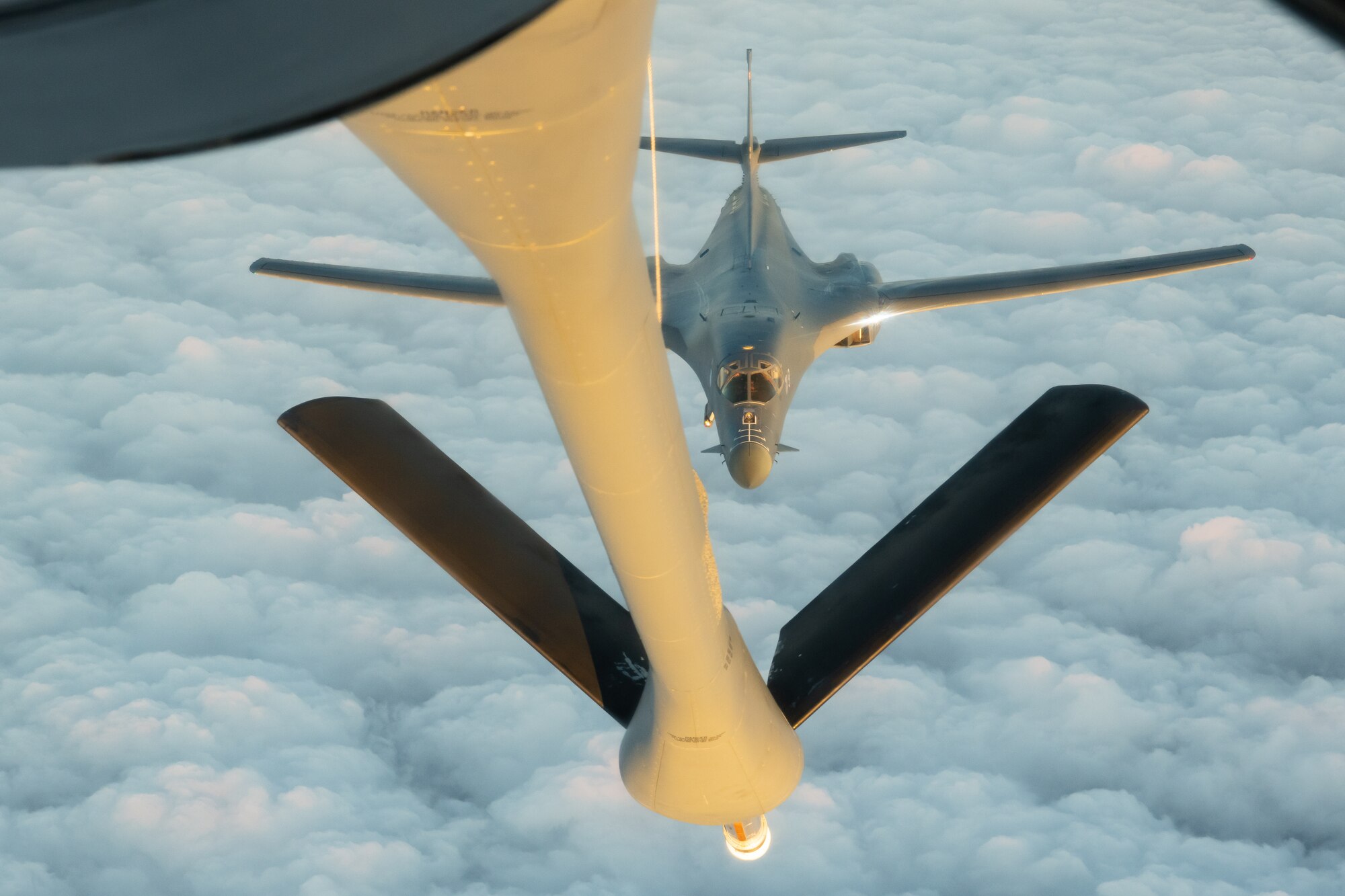 A U.S. Air Force B-1B Lancer from the 28th Bomb Wing, Ellsworth Air Force Base, S.D., approaches a KC-135 Stratotanker from the 909th Air Refueling Squadron, to refuel during a 32-hour round-trip sortie to conduct operations over the Pacific as part of a joint U.S. Indo-Pacific Command and U.S. Strategic Command (USSTRATCOM) Bomber Task Force (BTF) mission April 30, 2020. This operation demonstrates the U.S. Air Force’s dynamic force employment model in line with the National Defense Strategy’s objectives of strategic predictability with persistent bomber presence, assuring allies and partners. (U.S. Air Force photo by Senior Airman Cynthia Belío)