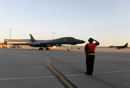 A maintainer salutes a B-1B Lancer assigned to the 28th Bomb Wing as it taxis to the runway to launch from Ellsworth Air Force Base, S.D., April 28, 2020. A pair of B-1s flew from the continental United States and conducted operations over the South China Sea as part of a joint U.S. Indo-Pacific Command and U.S. Strategic Command Bomber Task Force mission. (U.S. Air Force photo by Airman Quentin Marx)