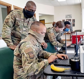 (From left) Staff Sgt. Chris Saenz, Staff Sgt. Anthony Guiteau, Tech. Sgt. Amber Harrison, and Airman 1st Class Victor Toeh work the verification station at a community-based testing facility in Friona, Texas, April 24.