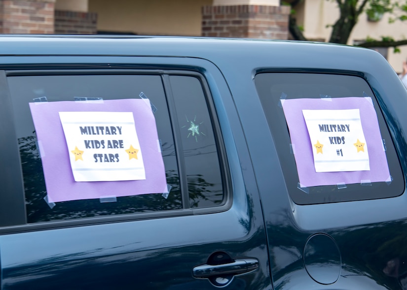 A car is decorated with signs to support children during the Month of the Military Child Parade on Joint Base Andrews, Md., April 24, 2020. The MotMC is about honoring children who have parents serving in the military, because they deal with more struggles than most children. (U.S. Air Force photo by Staff Sgt. Jared Duhon)