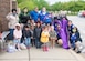 Child-care providers and children from Child Development Center 2 stand together after the Month of the Military Child parade on Joint Base Andrews, Md., April 24, 2020. Some of the providers are wearing purple as a visible way to show support and thank military youth for their strength and sacrifices. (U.S. Air Force photo by Staff Sgt. Jared Duhon)