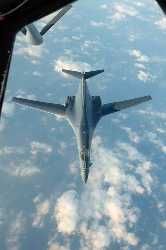A U.S. Air Force B-1B Lancer from the 28th Bomb Wing, Ellsworth Air Force Base, S.D., approaches a KC-135 Stratotanker from the 909th Air Refueling Squadron, to refuel during a 32-hour round-trip sortie to conduct operations over the Pacific as part of a joint U.S. Indo-Pacific Command and U.S. Strategic Command (USSTRATCOM) Bomber Task Force (BTF) mission April 30, 2020. This operation demonstrates the U.S. Air Force’s dynamic force employment model in line with the National Defense Strategy’s objectives of strategic predictability with persistent bomber presence, assuring allies and partners. (U.S. Air Force photo by Senior Airman Cynthia Belío)
