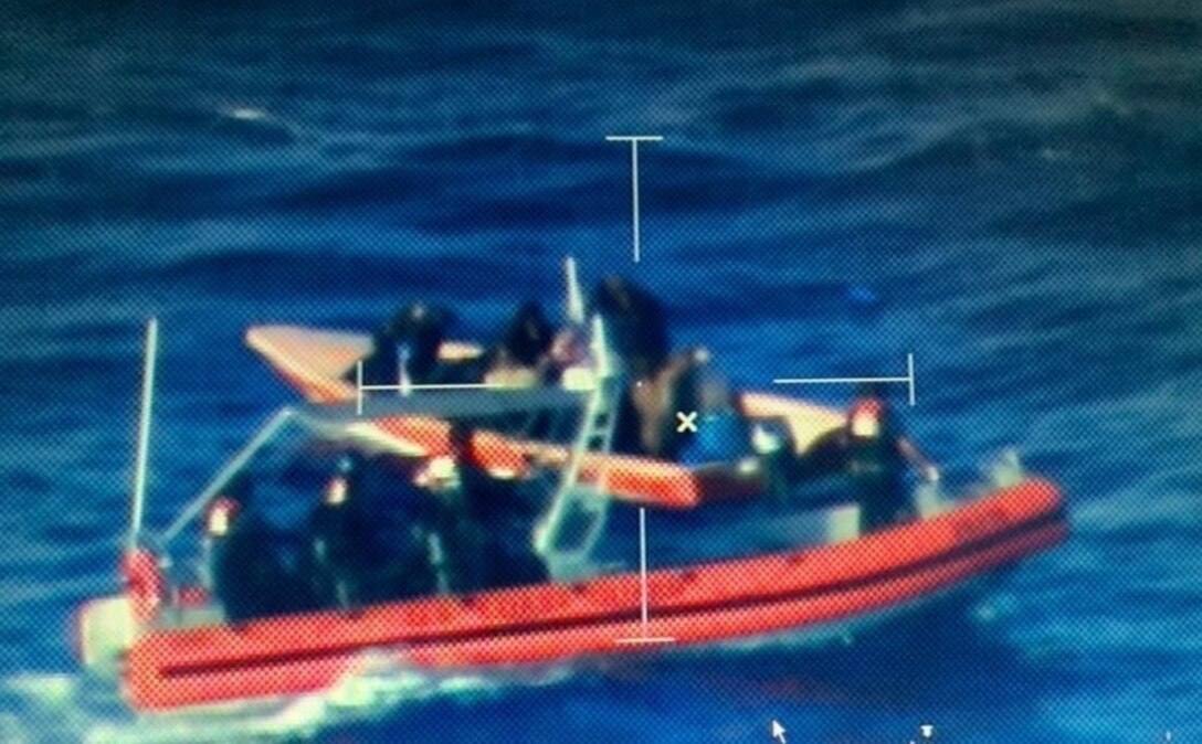 U.S. Coast Guard Cutter Joseph Doyle's (WPC-1133) cutter boat is on scene with a 25-foot illegal migrant vessel