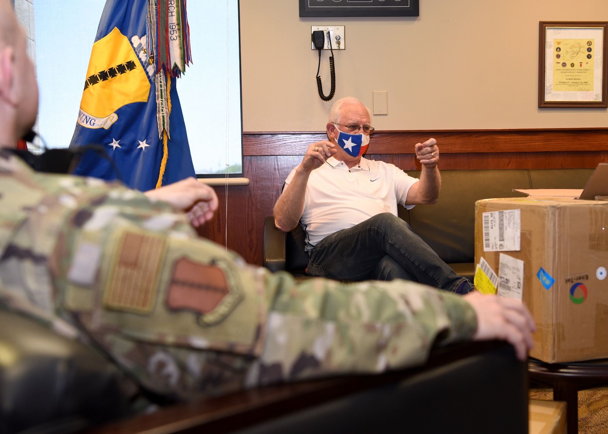 San Angelo Military Advisor Group Co-Chair, Mike Boyd, explains the circumstances of which the 2,100 disposable surgical masks were donated to the 17th Training Wing inside the Norma Brown building on Goodfellow Air Force Base, Texas, April 28, 2020. The donations came from Managing Partner of Principal LED, Bryan Vincent, and Ener-Tel Owner, Scott Wisniewski who purchased over 100,000 masks to donate across San Angelo’s medical members, first responders and Goodfellow Air Force Base.  (U.S. Air Force photo by Airman 1st Class Abbey Rieves)