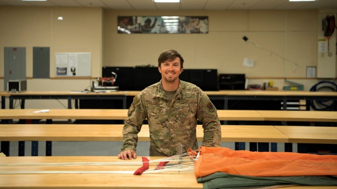 Tech. Sgt. Nicholas Cliché, 366th Operations Support Squadron aircrew flight equipment lead trainer, inspects his base-jumping gear, April 28, 2020, at Mountain Home Air Force Base, Idaho. Cliché prioritizes staying prepared and knowing his equipment as essential safety measures to base jumping.