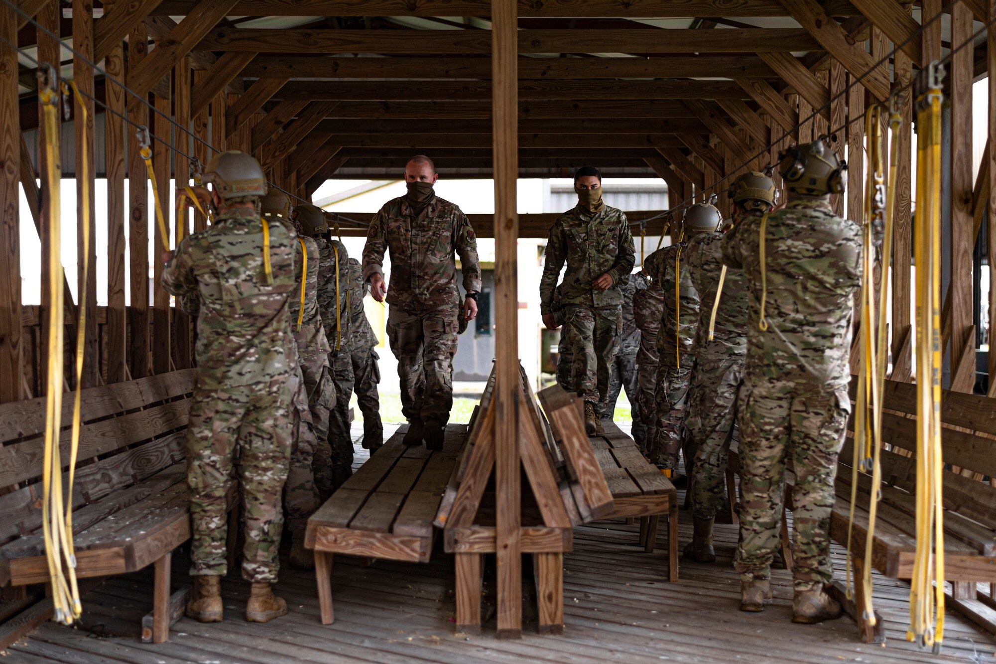 A photo of Airmen preparing for a static-line rehearsal