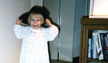 Mikayla Mast wears her father's Army boots and cap, June 1998. Retired Lt. Col. Jack H. Mast Jr. enlisted in the Army in 1986 and retired in 2010. Mikayla used to say she wanted to be a princess Army girl doctor when she grew up. (Courtesy photo)