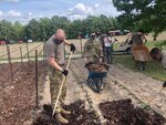 North Carolina National Guard Soldiers assist volunteers at the Inter-Faith Food Shuttle farm to ensure crops are planted and tended to for future harvests and distribution to the needy.