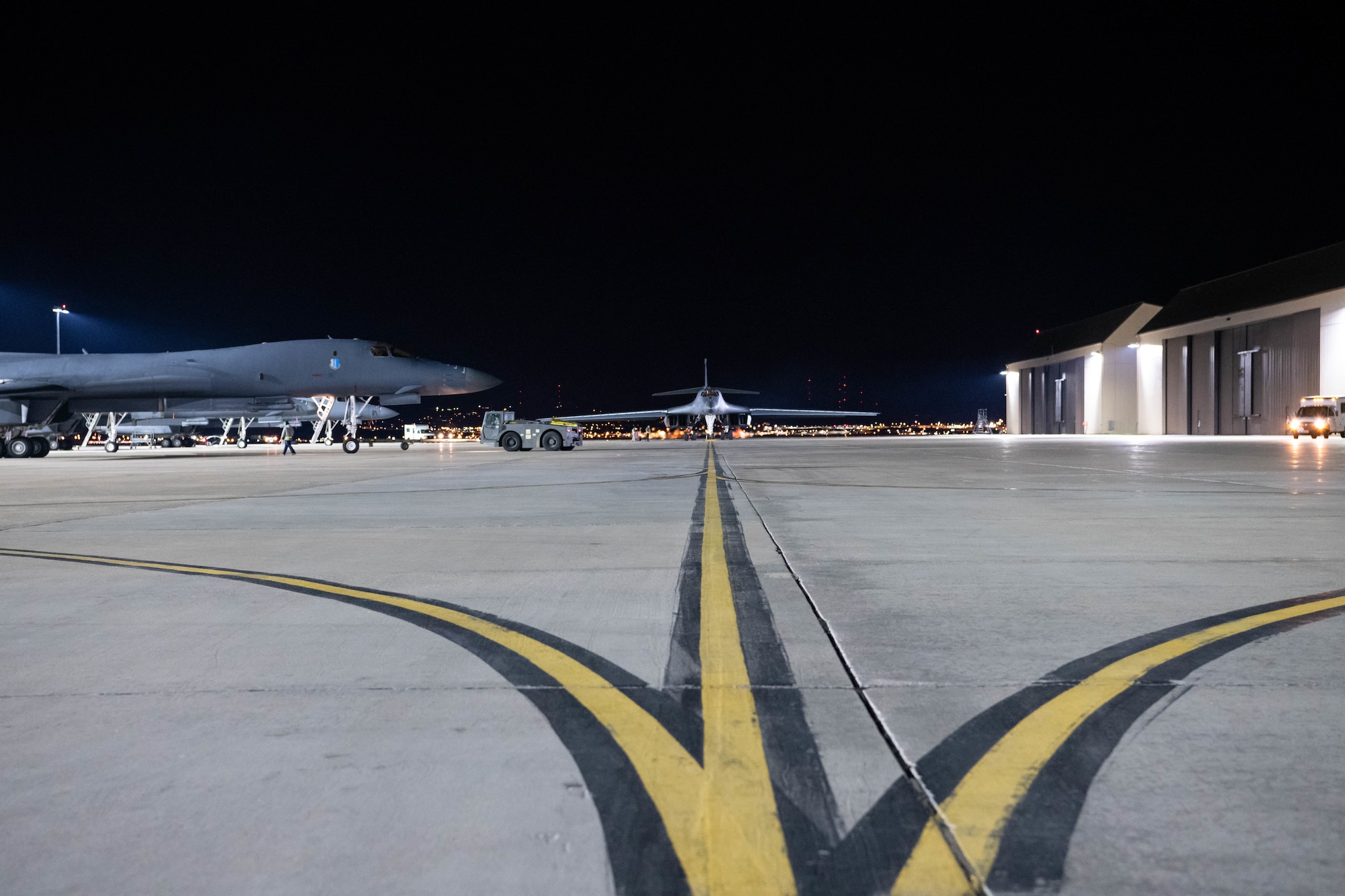 Two B-1B Lancers taxi to their spots on the flight line after landing at Ellsworth Air Force Base, S.D., April 30, 2020. The B-1s, assigned to the 28th Bomb Wing, flew a 32-hour round-trip sortie to conduct operations over the South China Sea as part of a joint U.S. Indo-Pacific Command and U.S. Strategic Command Bomber Task Force mission. (U.S. Air Force photo by Tech. Sgt. Jette Carr)